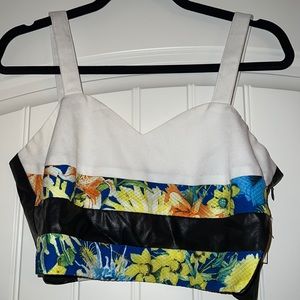 Crop top with faux leather and floral detailing. Only worn once